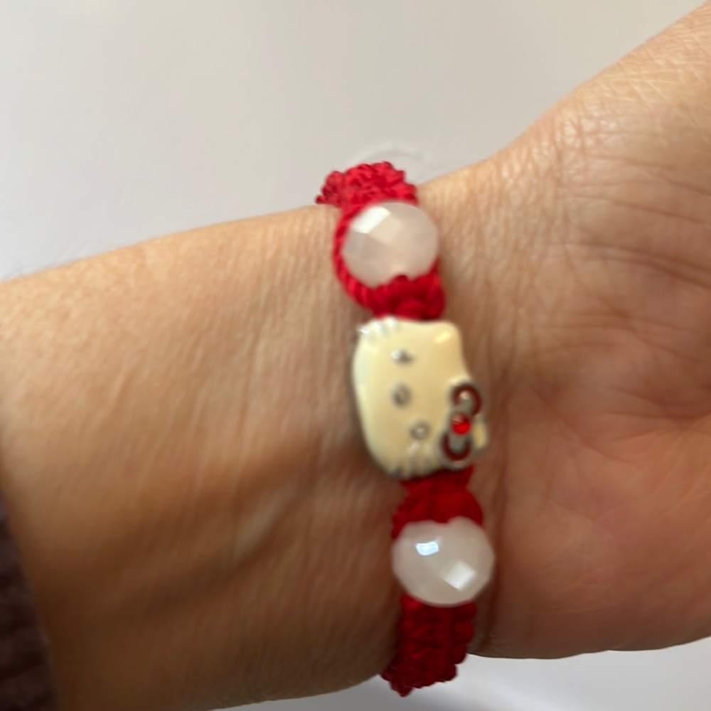Hello kitty draw string cord bracelet.